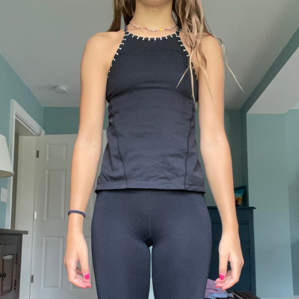 Black Ivivva tank top with 3 layers.